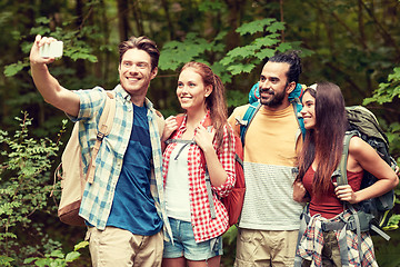 Image showing friends with backpack taking selfie by smartphone