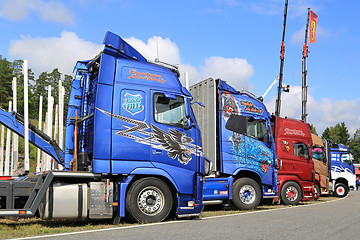 Image showing Side View of Colorful Show Trucks 