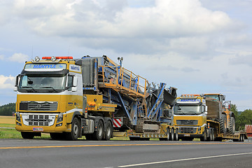 Image showing Two Volvo FH16 Semi Trucks Heavy Equipment Haul