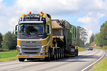 Image showing Yellow Volvo FH16 Semi Hauls Oversize Load