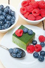 Image showing green tea matcha mousse cake with berries