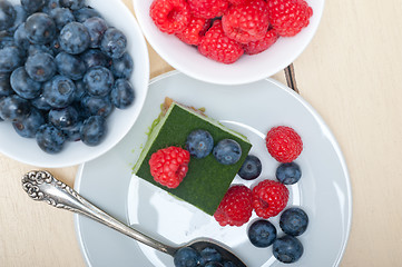 Image showing green tea matcha mousse cake with berries