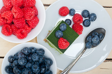 Image showing green tea matcha mousse cake with berries