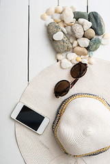 Image showing beach accessories on wooden board