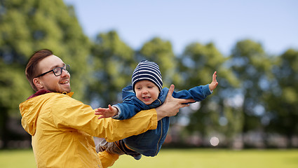 Image showing father with son playing and having fun outdoors