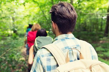 Image showing close up of friends with backpacks hiking