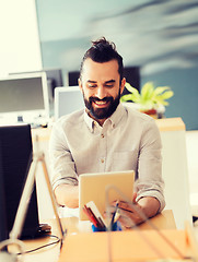 Image showing happy creative male office worker with tablet pc