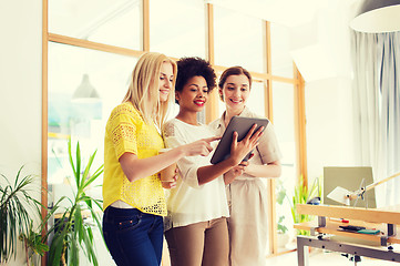 Image showing happy creative team with tablet pc in office