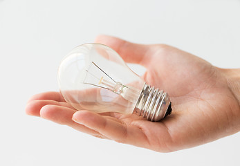 Image showing close up of hand holding edison lamp or lightbulb