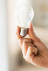 Image showing close up of hand holding edison lamp or lightbulb