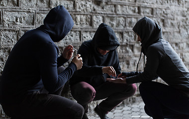 Image showing close up of people smoking cigarettes with drugs