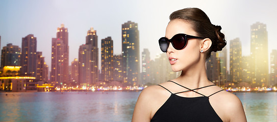 Image showing beautiful young woman in elegant black sunglasses