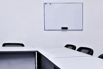 Image showing Empty meeting room in the office with tables and chairs