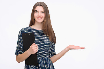 Image showing Woman showing something with open hand palm