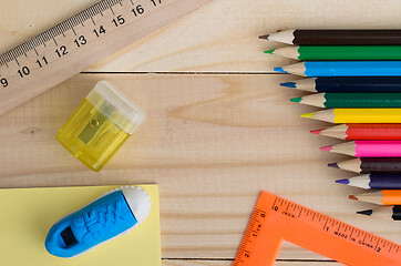 Image showing School stationery on wooden board