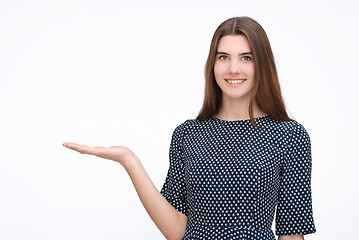 Image showing Woman showing something with open hand palm