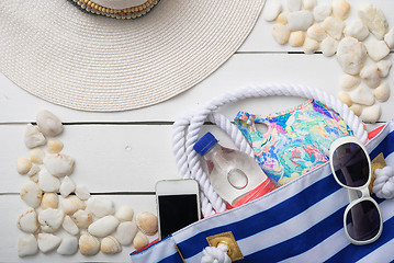 Image showing beach accessories on wooden board