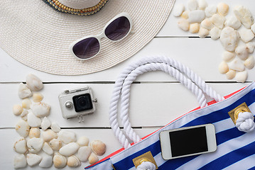 Image showing beach accessories on wooden board