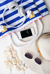 Image showing beach accessories on wooden board