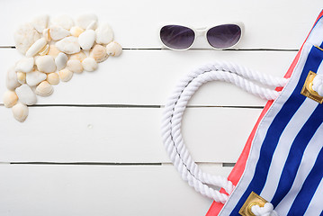 Image showing beach accessories on wooden board