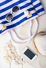 Image showing beach accessories on wooden board