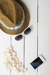 Image showing beach accessories on wooden board