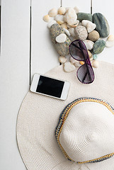 Image showing beach accessories on wooden board