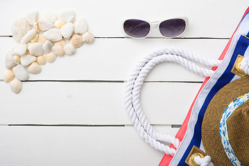 Image showing beach accessories on wooden board