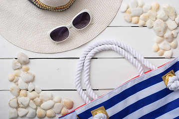 Image showing beach accessories on wooden board