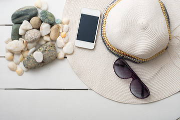 Image showing beach accessories on wooden board