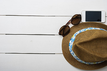 Image showing beach accessories on wooden board