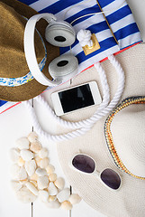 Image showing beach accessories on wooden board