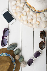 Image showing beach accessories on wooden board