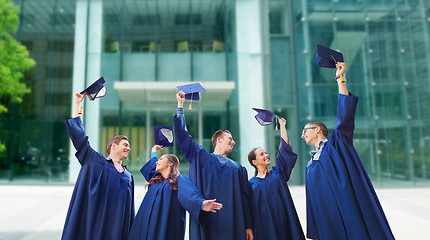 Image showing group of smiling students with mortarboards