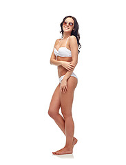 Image showing happy woman in sunglasses and bikini swimsuit