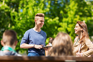 Image showing group of teenage students with tablet pc outoors