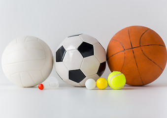 Image showing close up of different sports balls and shuttlecock