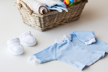 Image showing close up of baby clothes for newborn boy in basket