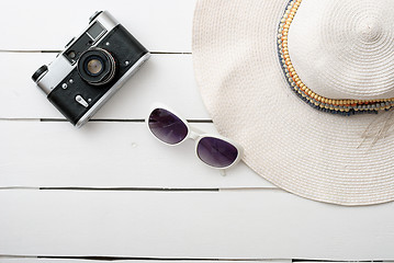 Image showing Beach accessories on wooden board