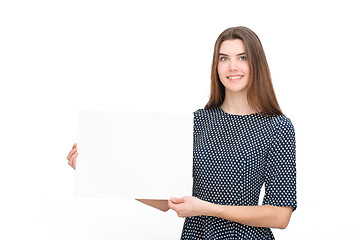 Image showing Young smiling woman show blank card or paper