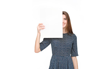 Image showing Young smiling woman show blank card or paper