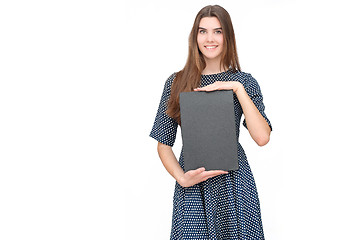 Image showing Young smiling woman show blank card or paper