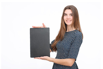 Image showing Young smiling woman show blank card or paper