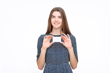 Image showing Portrait of young smiling business woman holding blank card