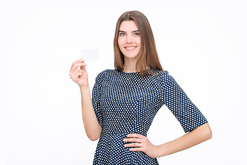 Image showing Portrait of young smiling business woman holding blank card