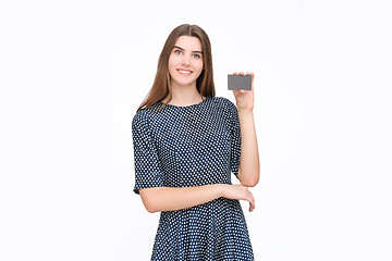 Image showing Portrait of young smiling business woman holding credit card