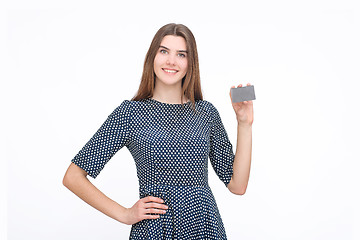 Image showing Portrait of young smiling business woman holding credit card