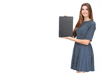 Image showing Young smiling woman show blank card or paper