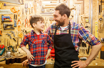 Image showing happy father and little son workshop