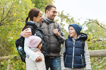 Image showing happy family with backpacks hiking